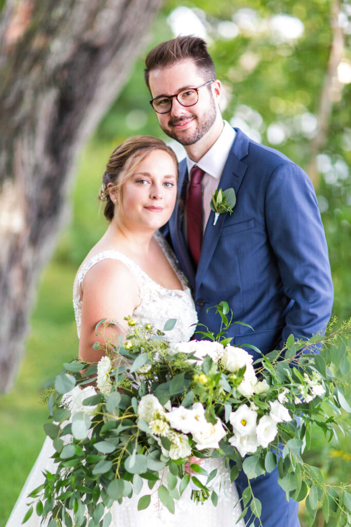 bride & groom pose for formal outdoor portrait at elegant wedding at Red Crown Lodge