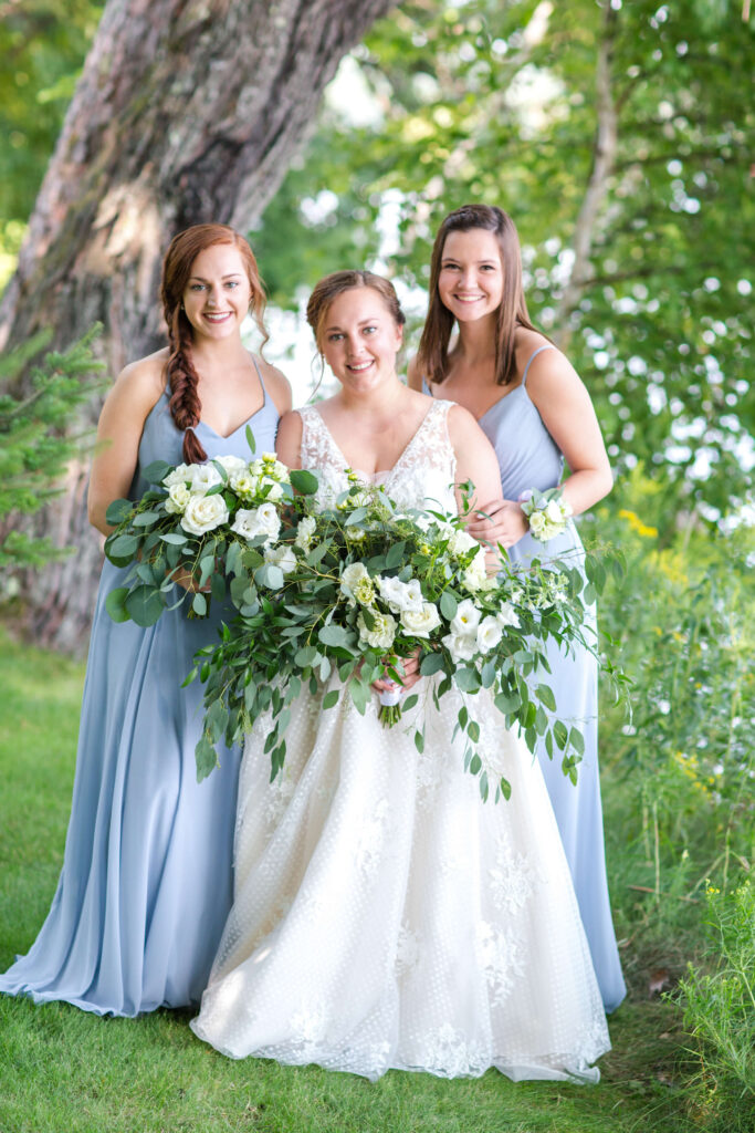 bride & two bridesmaids pose for a portrait at elegant wedding at Red Crown Lodge