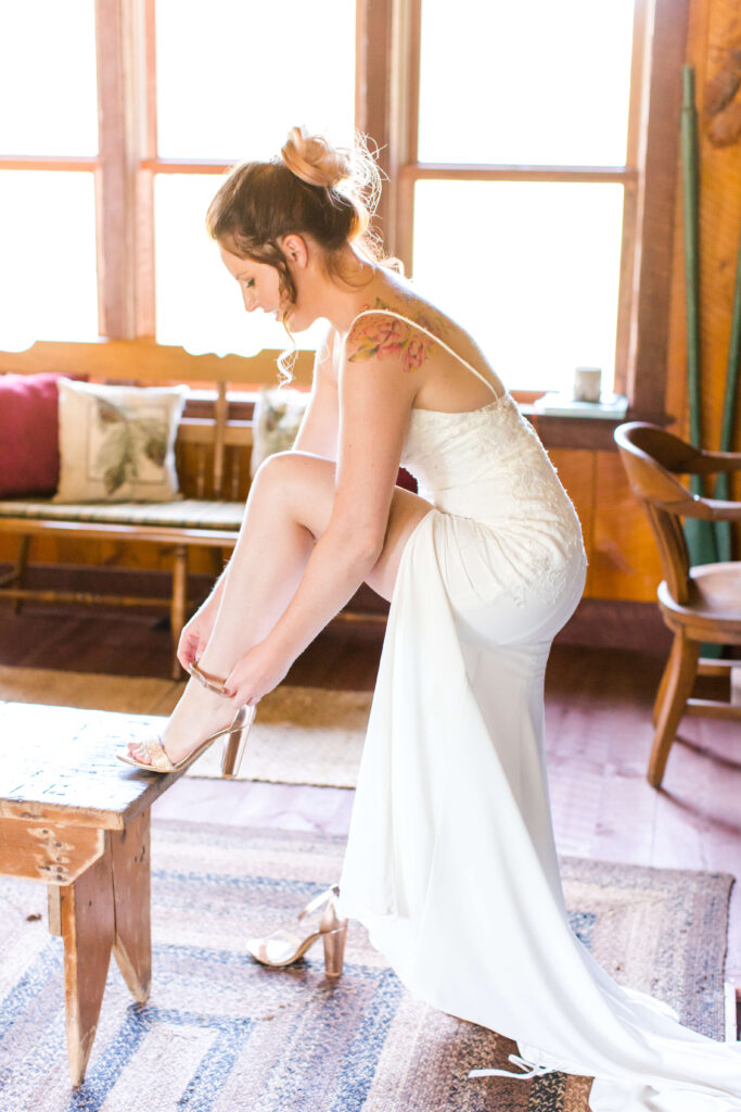 Bride getting ready at her Eagle River Cabin Wedding