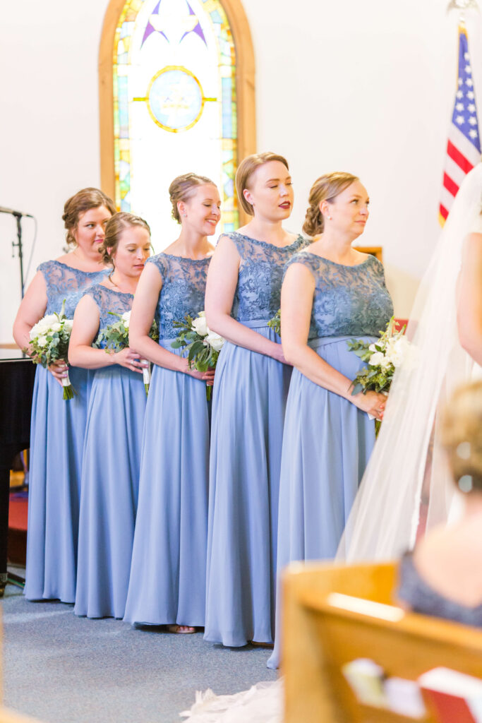 Bridesmaids watching ceremony at Pioneer Lake Lutheran Church in Conover WI 