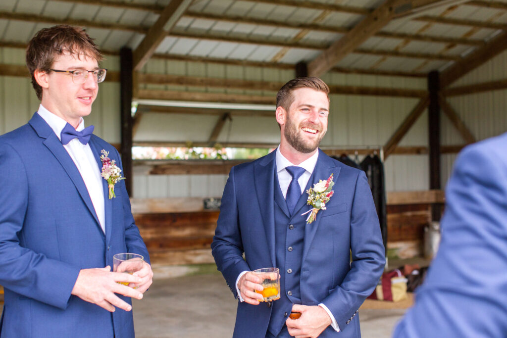 Groom with groomsmen at summer wedding at farmin' betty's 