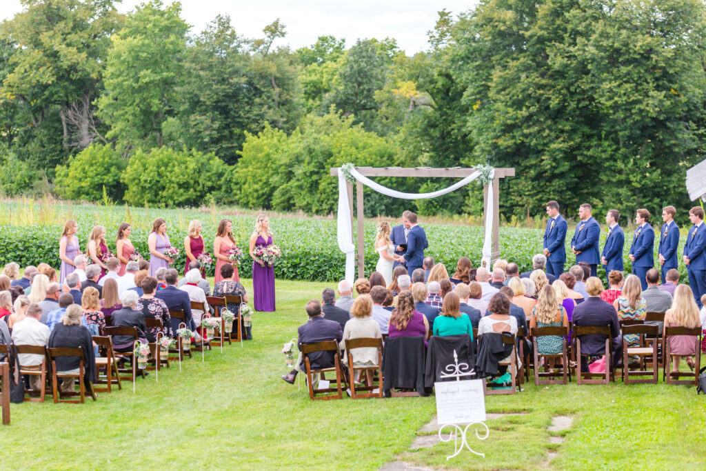 outdoor ceremony at summer wedding at farmin' betty's 