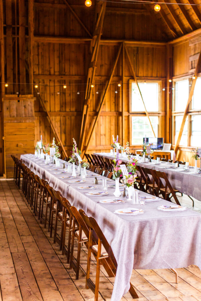 barn reception farm tables at summer wedding at farmin' betty's 