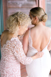 Mother of Bride helping bride get ready