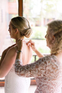Mother of Bride helping bride get ready