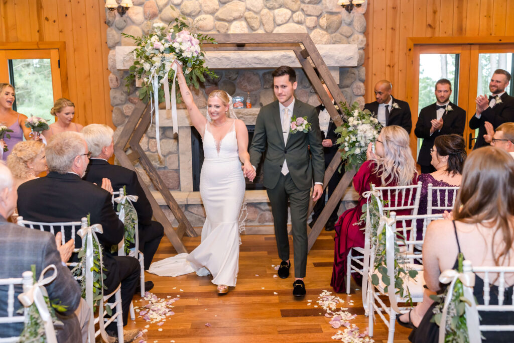 Bride & Groom coming down the aisle at Chippewa Retreat