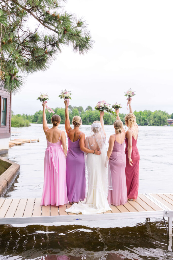 Bridesmaids on dock at Chippewa Retreat