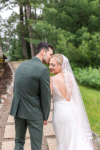 Bride & Groom walking up the path at Chippewa Retreat