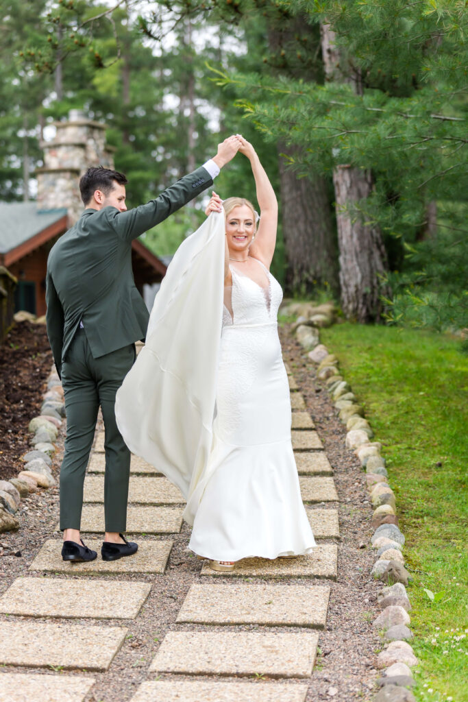 Bride & Groom walking up the path at Chippewa Retreat