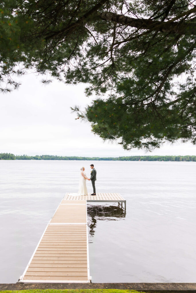 Bride & Groom on the dock at Chippewa Retreat Resort