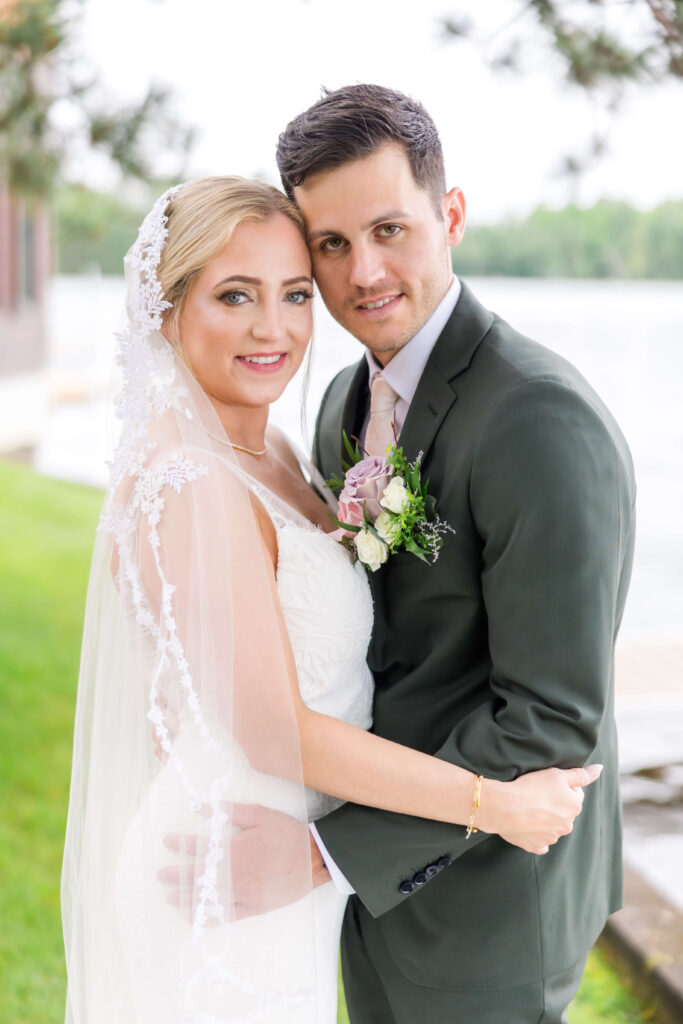 Bride & Groom posing for portraits at Chippewa Retreat