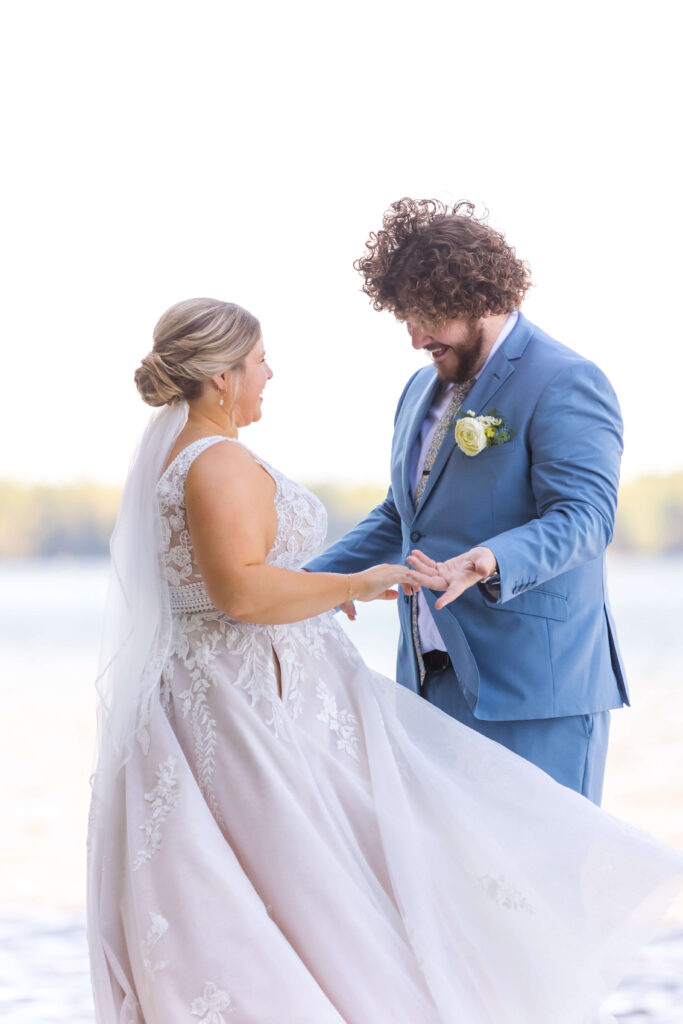 Couple share their first look and private vows on the dock at their dillman's resort wedding 