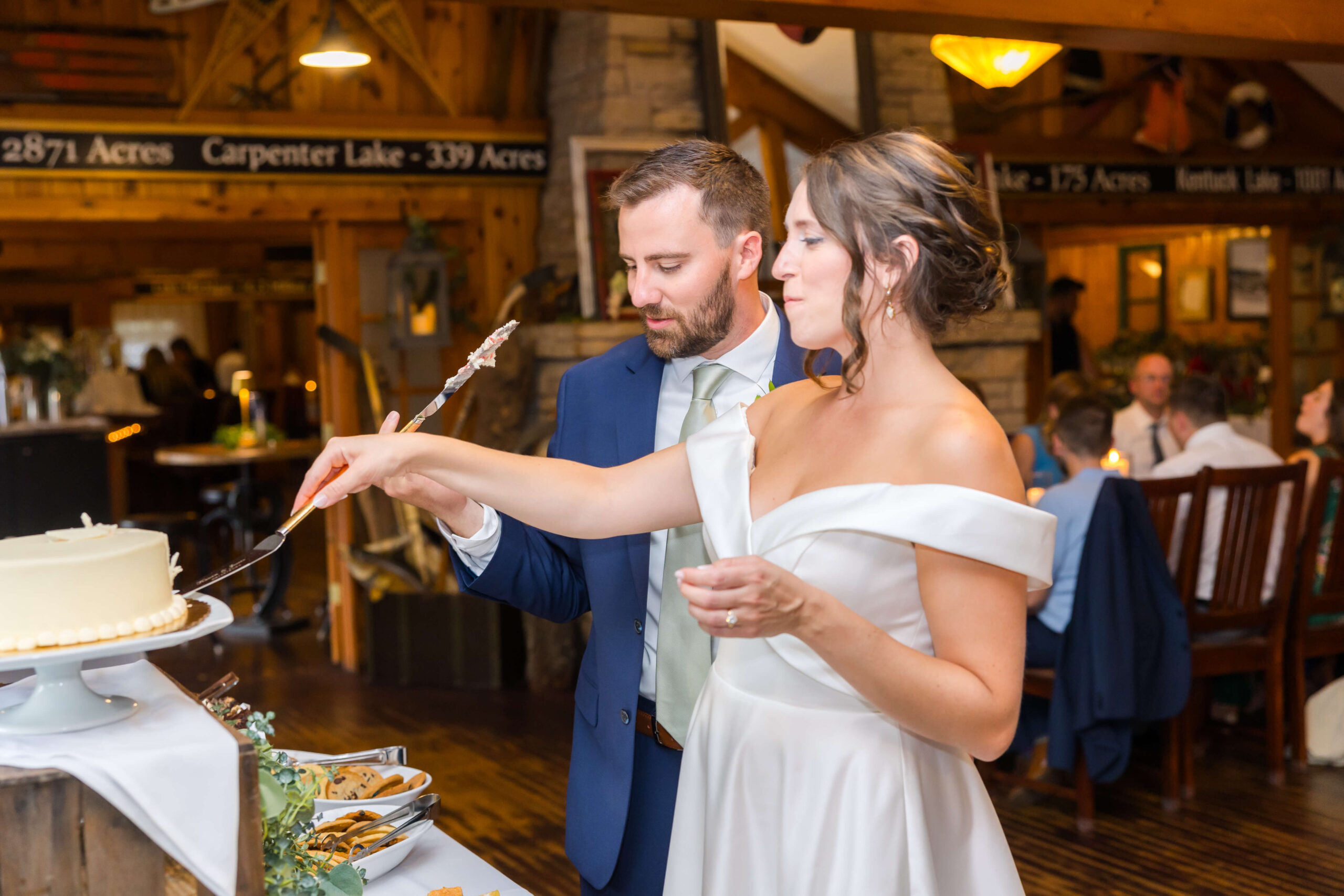 Couple cutting wedding cake