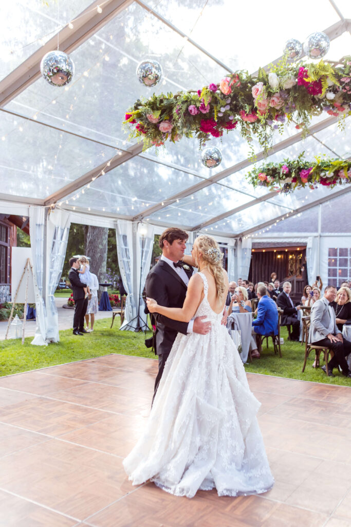 Bride & Groom share their first dance under a clear tent at Red Crown Lodge